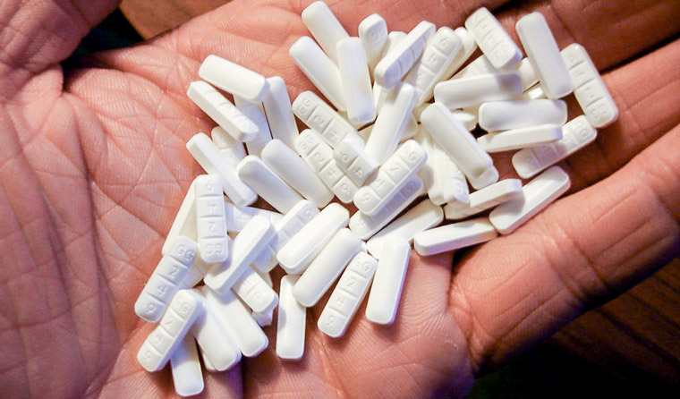 Patient discussing prescription medicine safety with a pharmacist